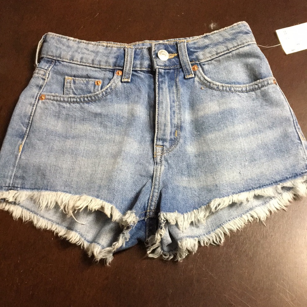 High waisted denim shorts with frayed ends